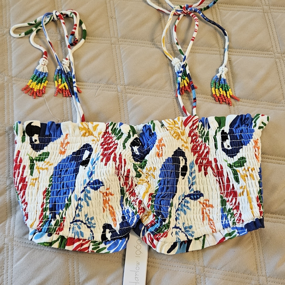 House of Harlow 1960 smocked crop top featuring a parrot print and beaded tassel